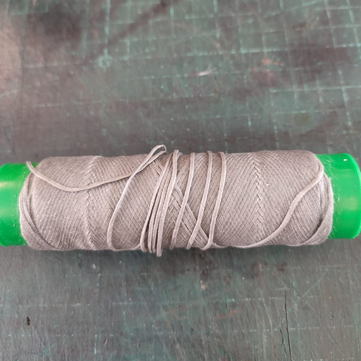 Grey waxed thread